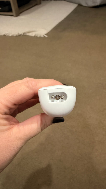 hands plugging the mypawz replacement charging cable into the base of the pawfect trimmer, indicator lights on