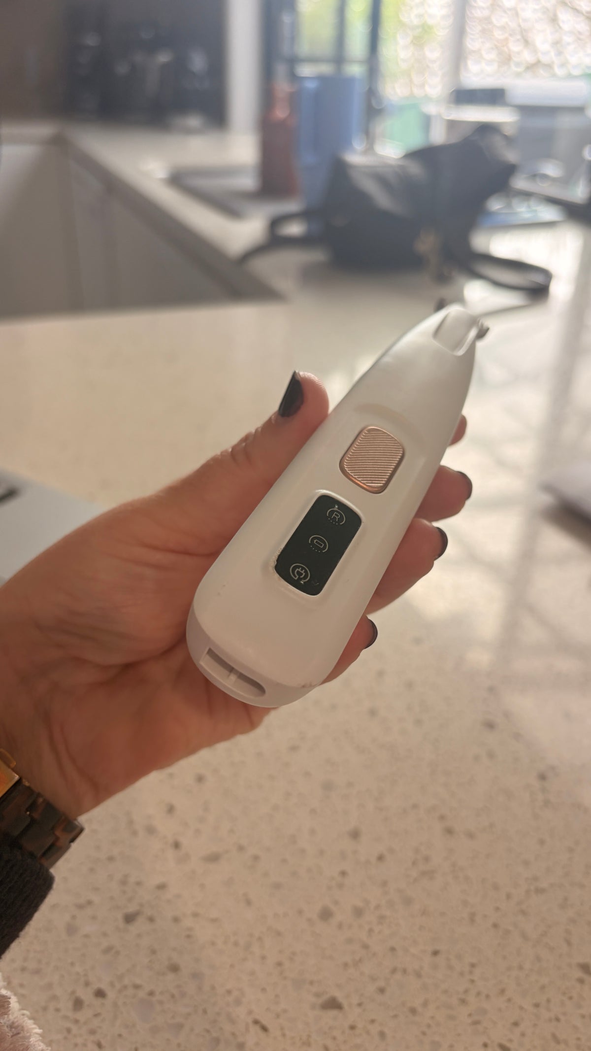close up of the rectangular two-pin charging port in the base of the mypawz pawfect trimmer