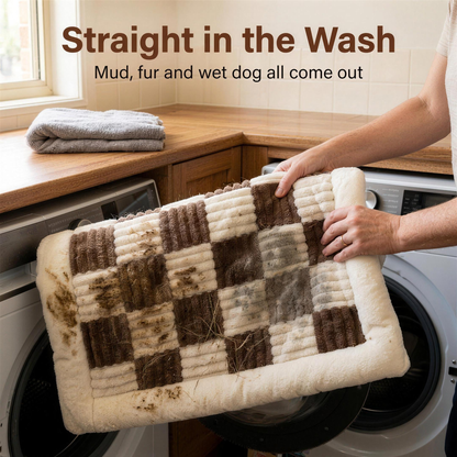 muddy mypawz plush backseat bed being folded into a front loading washing machine